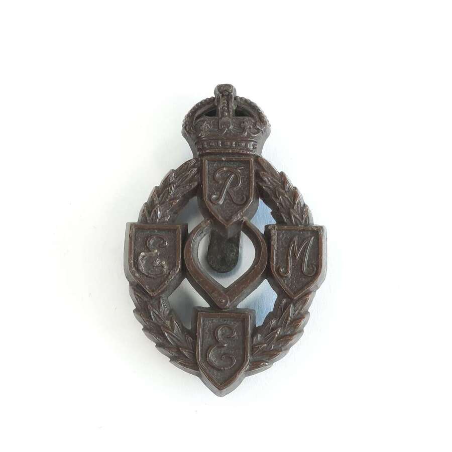 REME Plastic Cap Badge